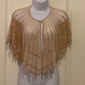 TSE9000 Girls shawl champagne color size one size.